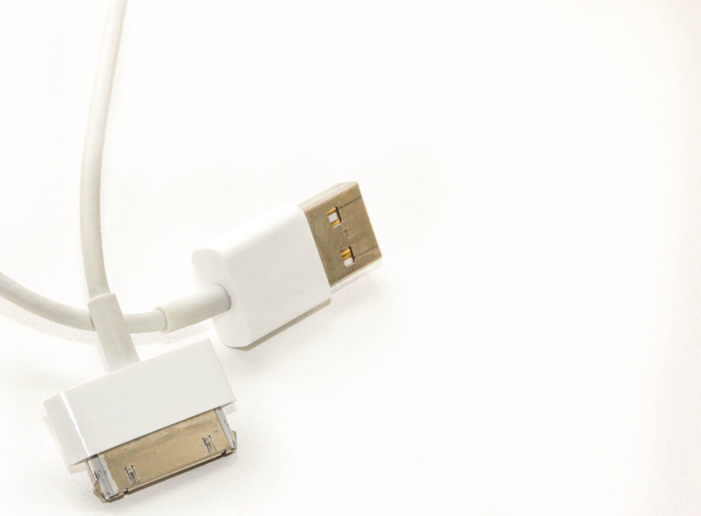 White wire usb mobile charging cable. 2 different cellphone plugs adapter from isolated on background